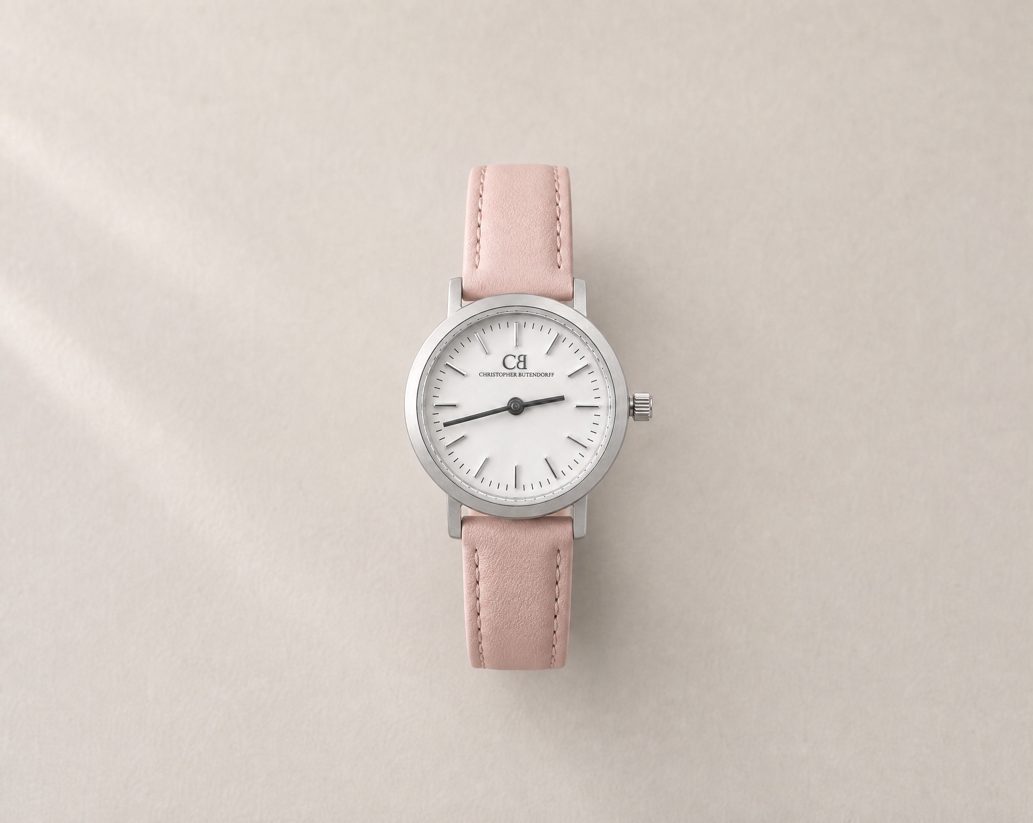 Venustus Swiss Made modular women's watch — round silver case with white dial and pink leather strap, close-up product view