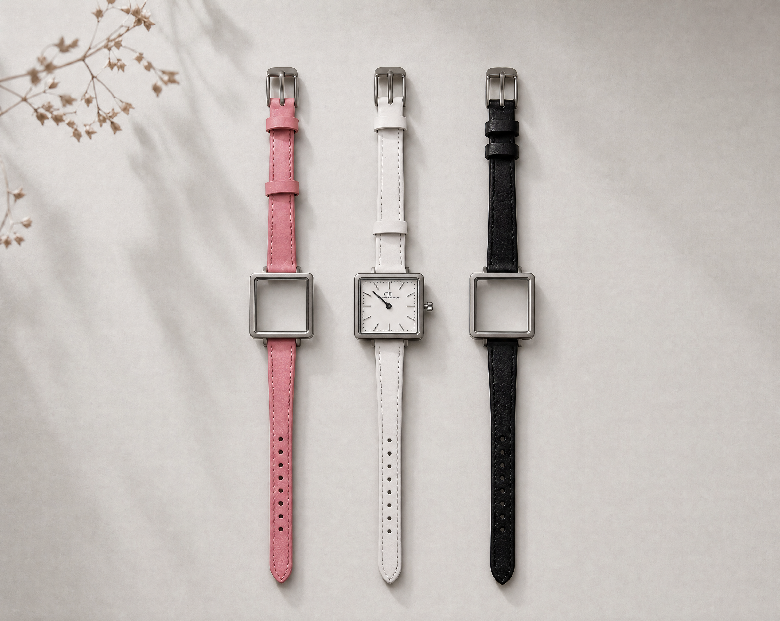 Venustus Swiss Made modular women's watch — square silver case with white dial, shown with interchangeable pink, white and black leather straps