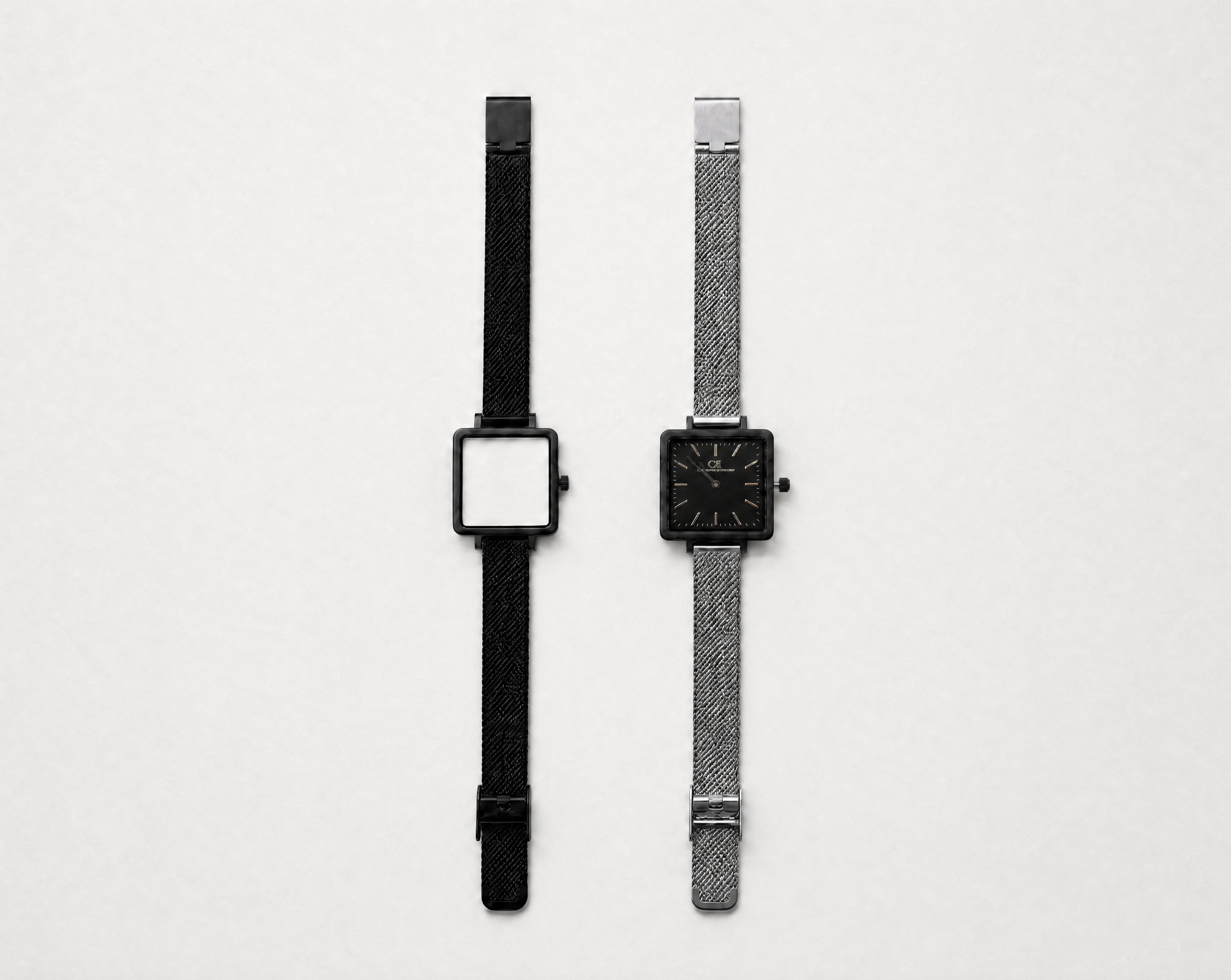 Aureum Swiss Made modular watch — square black case with black mesh strap and square silver case with black dial and silver mesh strap