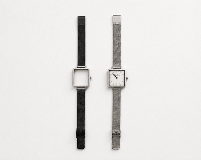 Aureum Swiss Made modular watch — square silver case with white dial and silver mesh strap, shown alongside black case with black mesh strap