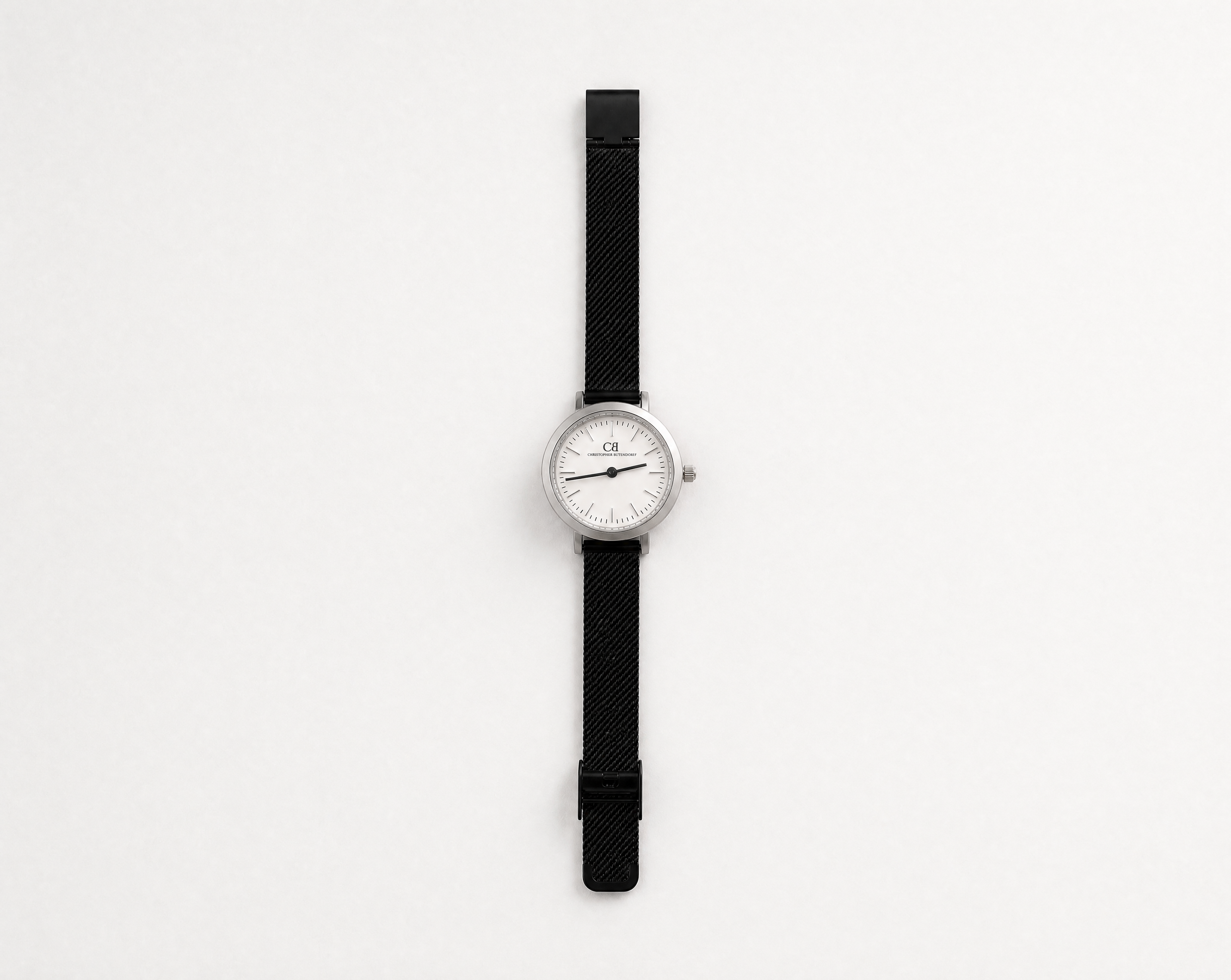 Aureum Swiss Made modular watch — round silver case with white dial and black mesh strap, close-up product view