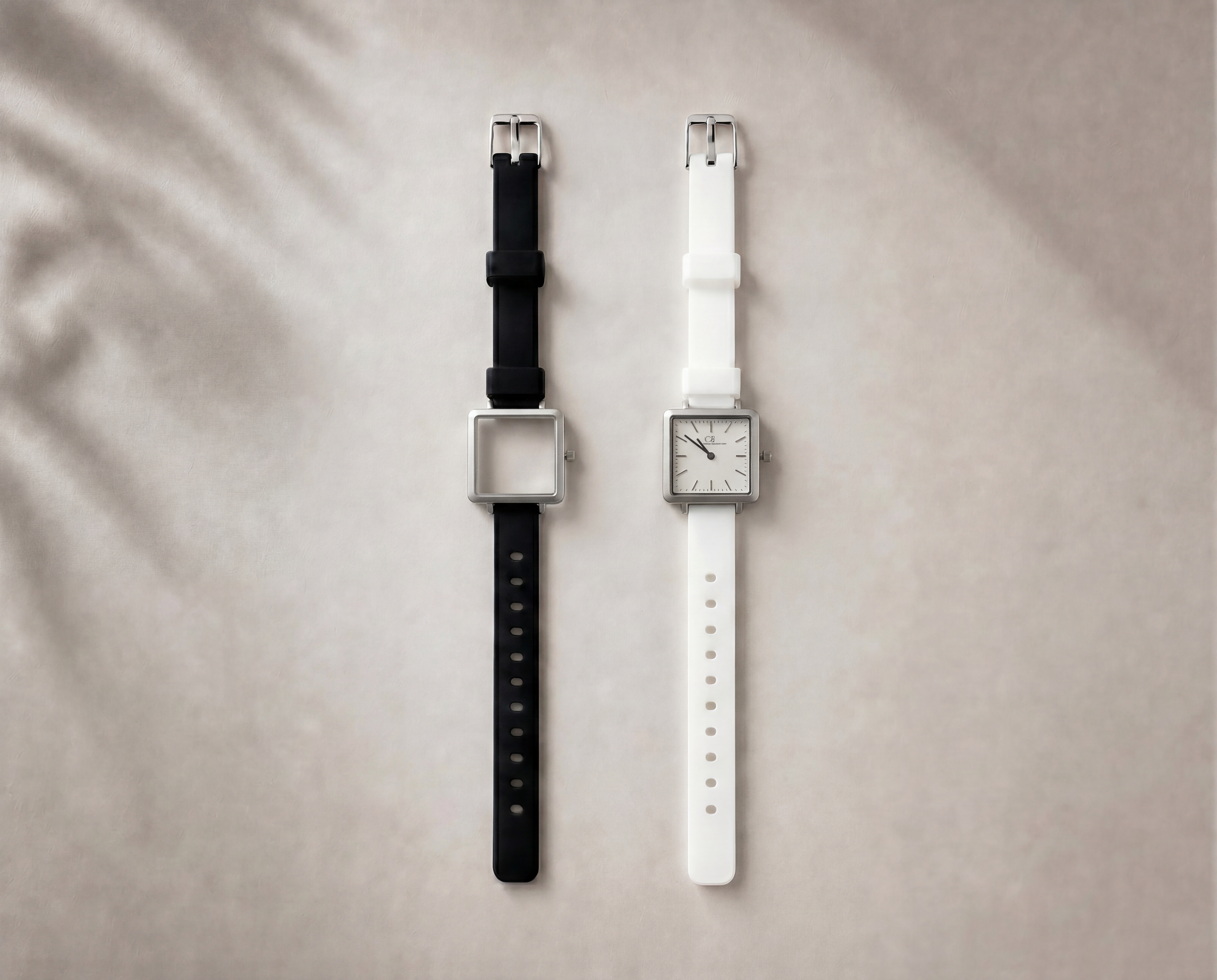 Certamen Swiss Made modular women's sport watch — square silver case with white dial, shown with interchangeable black and white PVC straps