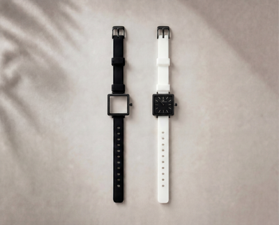 Certamen Swiss Made modular women's sport watch — square black case with black dial, shown with interchangeable black and white PVC straps