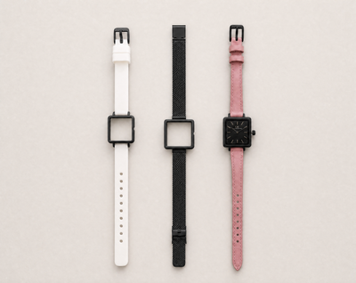 Mixta Swiss Made modular women's watch — square black case with black dial, shown with interchangeable white PVC, black mesh and pink leather straps
