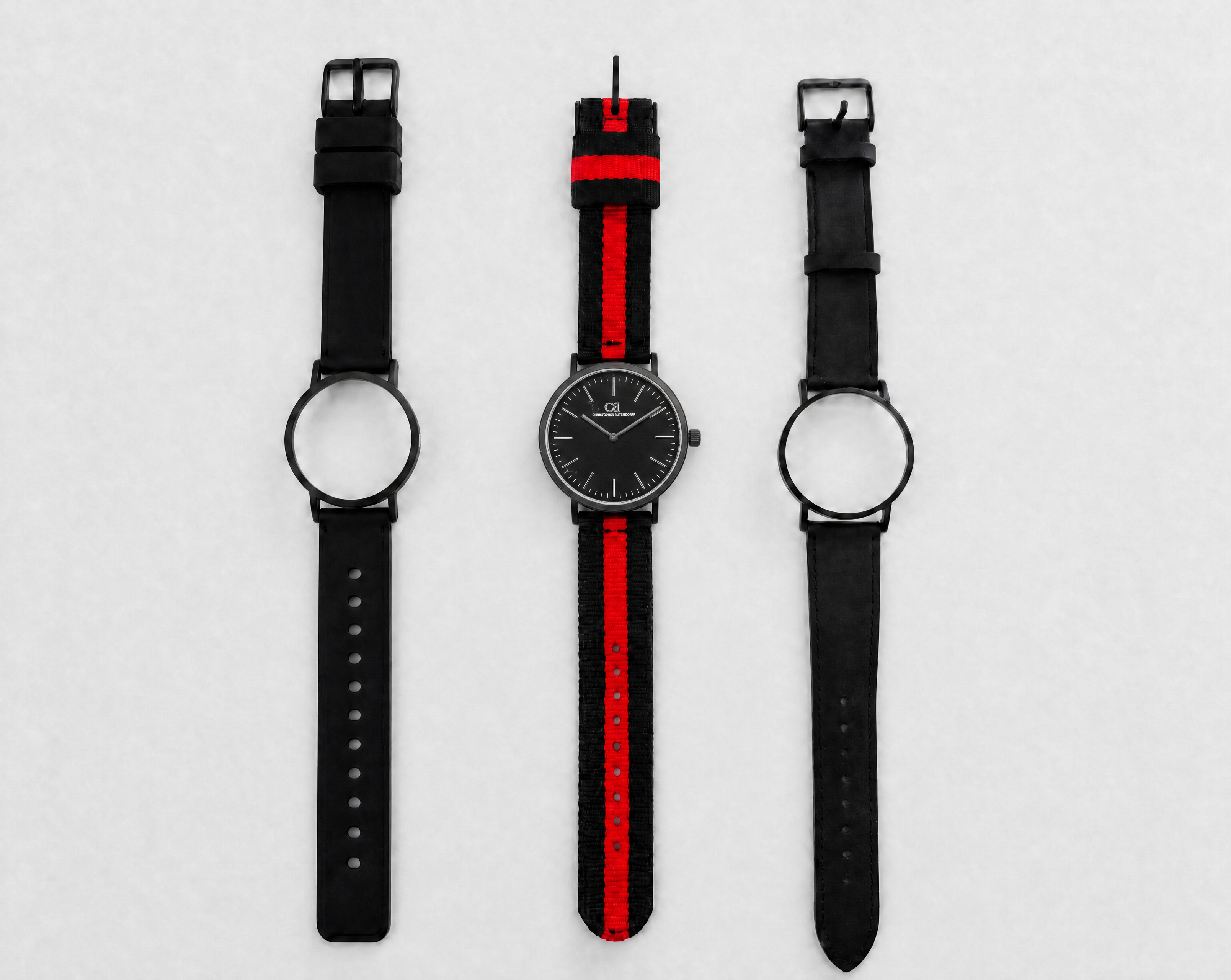 Mixtus Swiss Made modular watch — round black case with black dial, shown with black-red nato strap and black leather strap