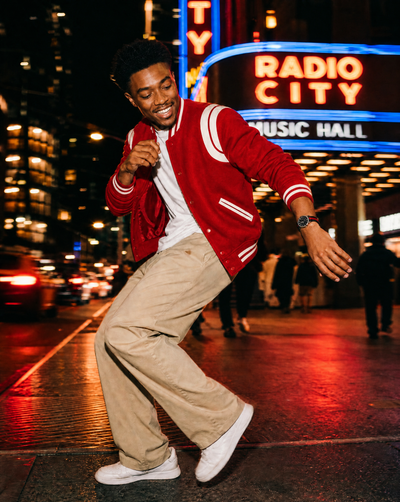 Man dancing outside Radio City Music Hall in New York wearing Tela Swiss Made modular watch — Christopher Butendorff
