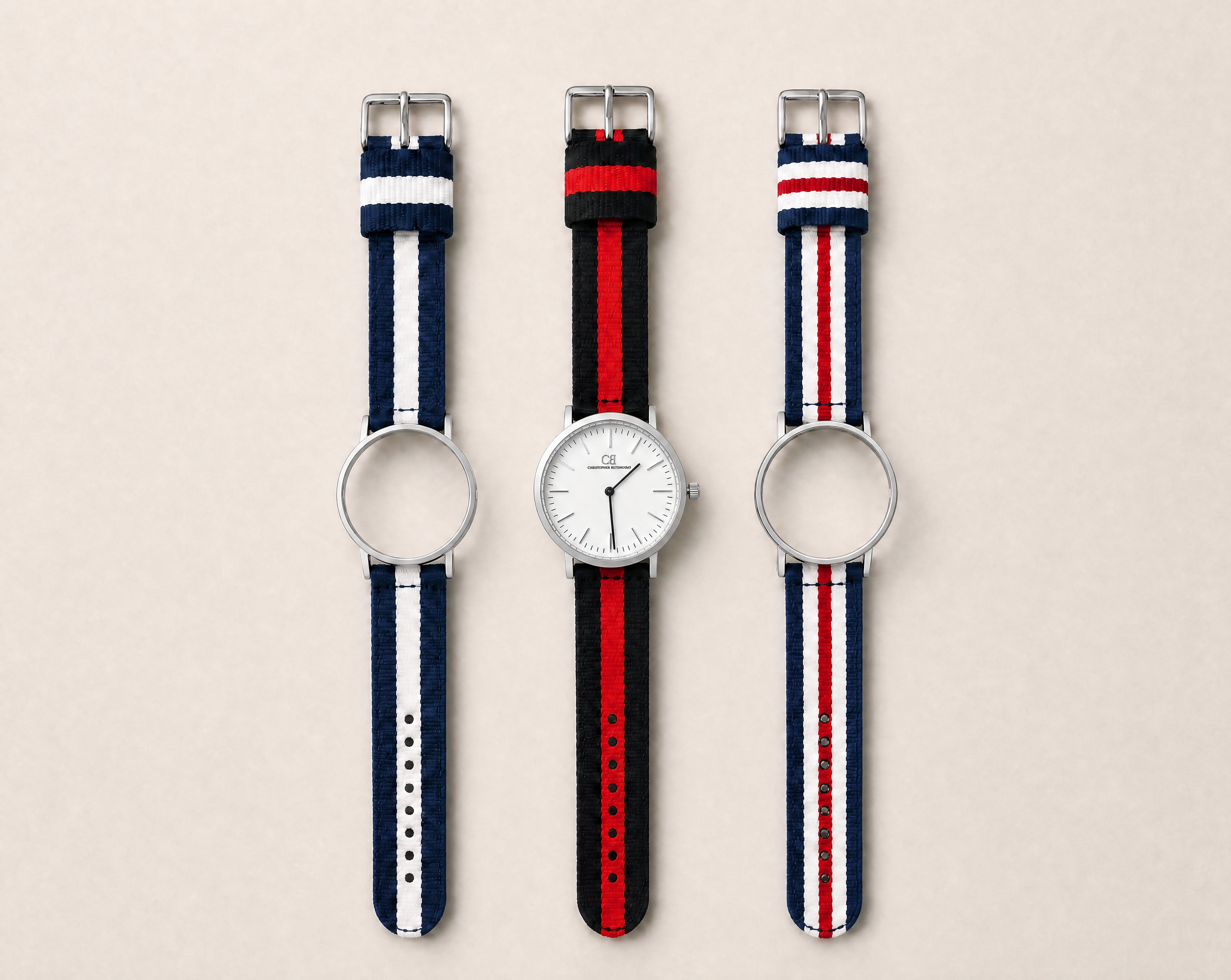 Tela Swiss Made modular watch — round silver case with white dial, shown with three interchangeable nato straps in navy-white, black-red and navy-red-white