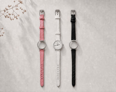 Venustus Swiss Made modular women's watch — round silver case with white dial, shown with interchangeable pink, white and black leather straps