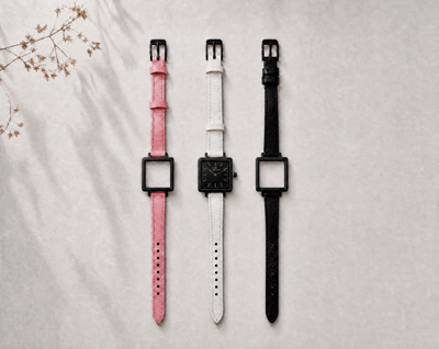 Venustus Swiss Made modular women's watch — square black case with black dial, shown with interchangeable pink, white and black leather straps
